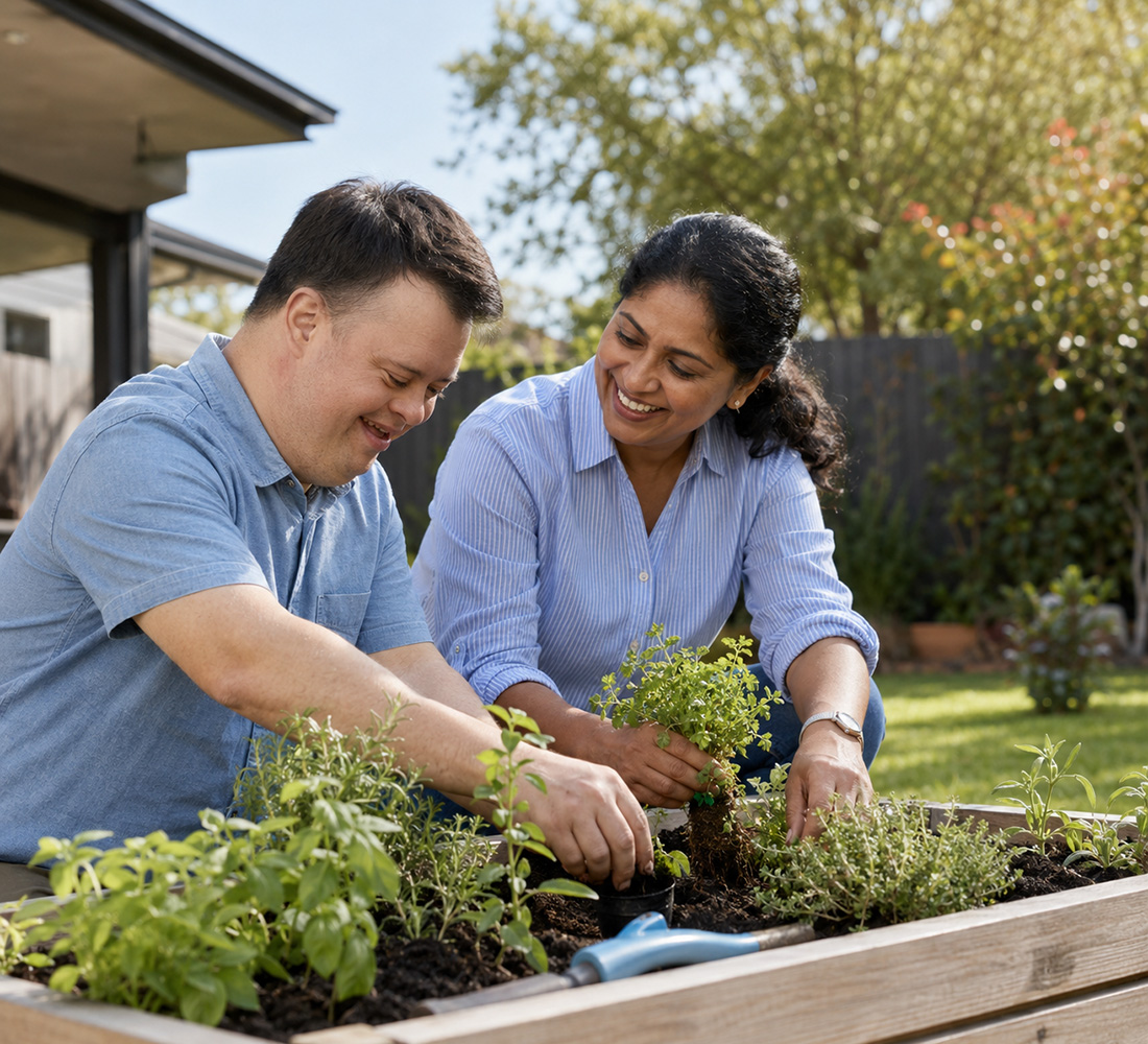 Blue Lotus Care support worker gardening with an NDIS participant