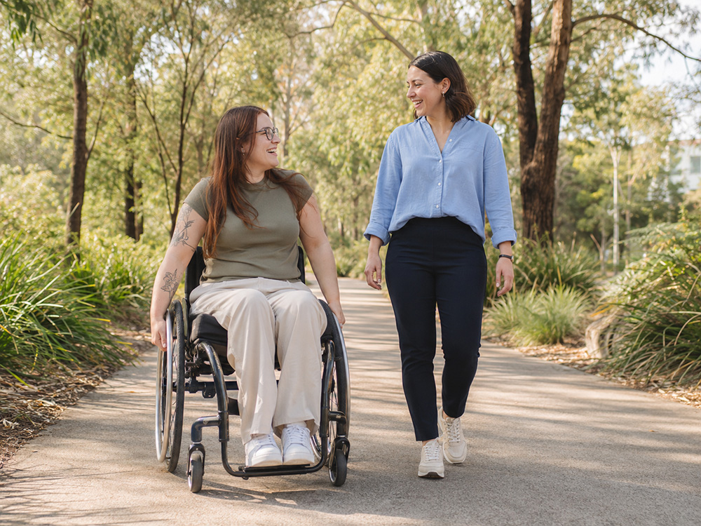 NDIS participant enjoying a community outing with a Blue Lotus Care support worker