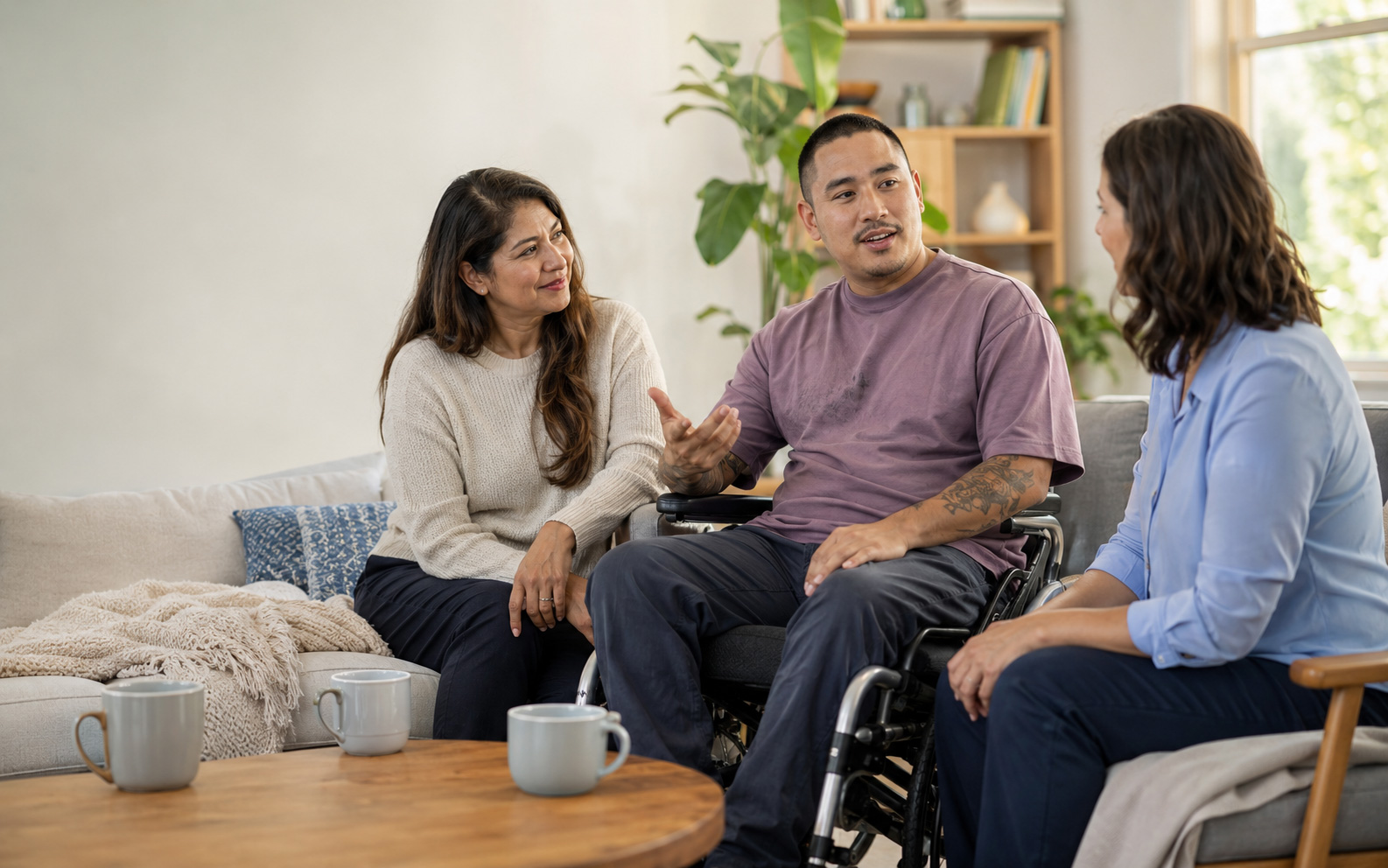 NDIS participant discussing personal goals with family and a support professional